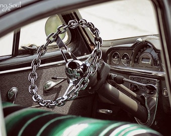 On Lock Photograph of a Chain Steering Wheel on a Vintage