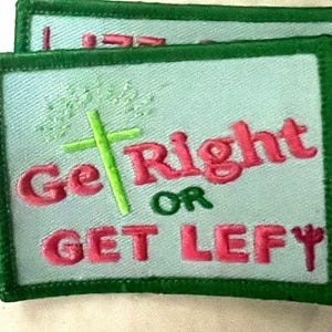 May include: Two embroidered patches with a light blue background and green borders. The patches feature the text "Get Right OR Get Lefty" in pink, with a green cross and floral accents.
