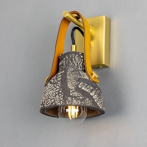 Nagi Organic Ceramic Wall Sconce with Rescued Fire-Hose Strap, Black Clay