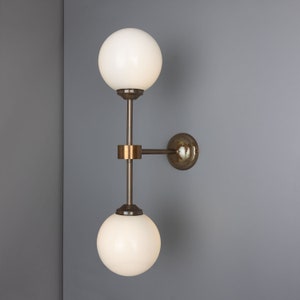 Yaounde Double Opal Glass Globe Brass Wall Sconce