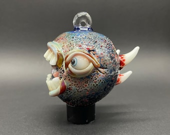 Screaming cyclops glass ornament