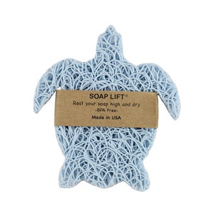 May include: A light blue turtle-shaped soap dish made of woven material. The dish has a brown label that reads "SOAP LIFT&reg; Rest your soap high and dry -BPA Free- Made in USA".