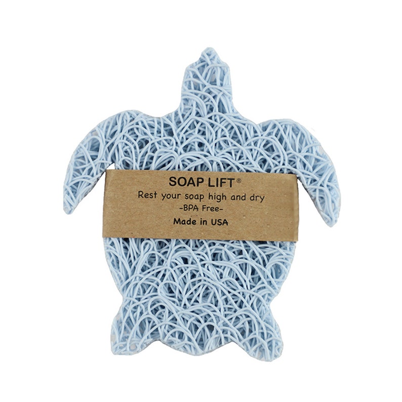 May include: A light blue turtle-shaped soap dish made of woven material. The dish has a brown label that reads "SOAP LIFT&reg; Rest your soap high and dry -BPA Free- Made in USA".