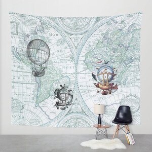 May include: A vintage world map tapestry with a blue and green color scheme. The map features three airship illustrations, each with a unique design. The airship illustrations are in the center of the map, with the map extending out to the edges of the tapestry.