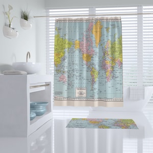 May include: A blue and white shower curtain with a vintage world map design. The map features continents in different colors and includes the text "THE WORLD".