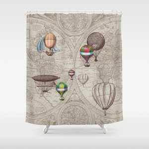 May include: A vintage world map shower curtain featuring hot air balloons and an airship. The map is in shades of brown and beige with a faded look. The balloons are in various colours, including red, blue, green, and yellow.