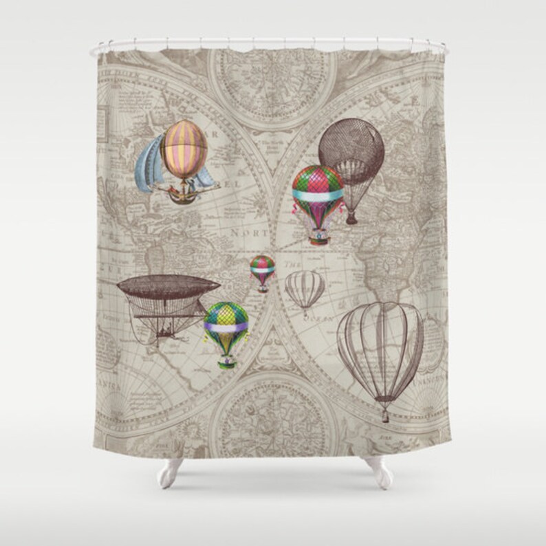 May include: A vintage world map shower curtain featuring hot air balloons and an airship. The map is in shades of brown and beige with a faded look. The balloons are in various colours, including red, blue, green, and yellow.