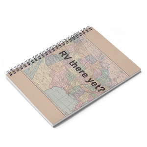 May include: A spiral bound notebook with a vintage map of the United States on the cover. The text "RV there yet?" is printed on the map.