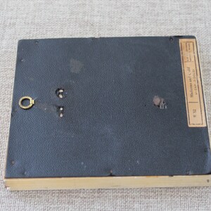 May include: The back of a small, framed picture with a black backing and a label that reads "Made in Italy by A. Sal.  No. C-240  Size 3 1/2 x 5"