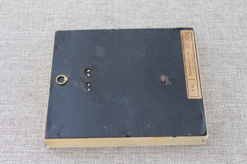 May include: The back of a small, framed picture with a black backing and a label that reads "Made in Italy by A. Sal.  No. C-240  Size 3 1/2 x 5"
