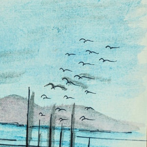 May include: A watercolor painting of a seascape with a row of boats in the water and a flock of birds flying overhead. The sky is a light blue color and the water is a darker blue. The boats are black and the birds are black.