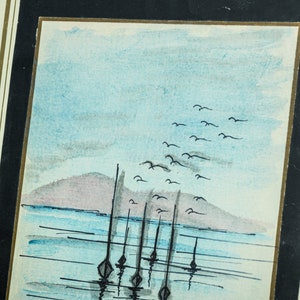 May include: A watercolor painting of a seascape with a distant island, a flock of birds flying overhead, and several sailboats anchored in the water.