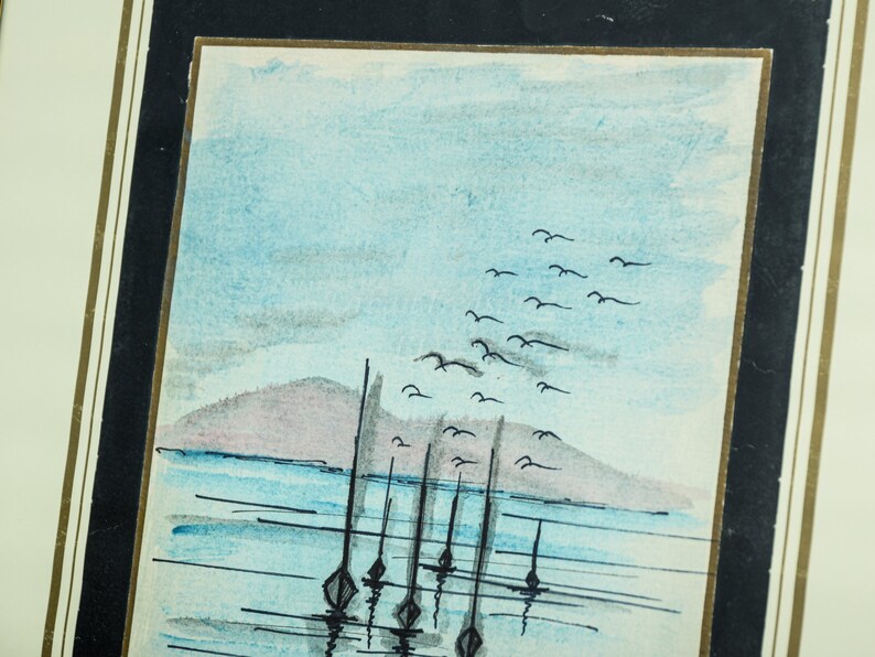 May include: A watercolor painting of a seascape with a distant island, a flock of birds flying overhead, and several sailboats anchored in the water.