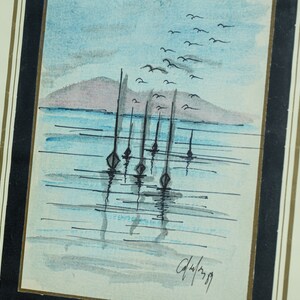 May include: A watercolor painting of a seascape with a distant island and a flock of birds flying overhead.  There are several sailboats anchored in the water with their reflections visible. The painting is signed "G.Wilson 79".