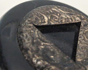 Early Vintage Bakelite Round Brooch with Patterned Metal Center Triangle Black