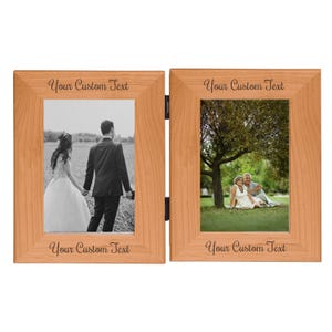 May include: A double wooden photo frame with two rectangular openings. Each frame holds a black and white photograph. The top and bottom of each frame are inscribed with the words "Your Custom Text".