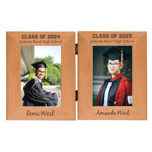 May include: A hinged, wooden photo frame with two openings, each holding a graduation portrait. The left frame reads "CLASS OF 2024" and "Jackson-Reed High School" with the name "Remi West" below the photo. The right frame reads "CLASS OF 2025" and "Jackson-Reed High School" with the name "Amanda West".