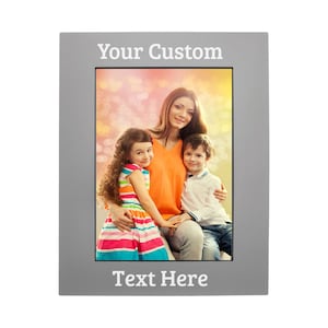 May include: A gray picture frame with the text "Your Custom" at the top and "Text Here" at the bottom. The frame holds a photo of a woman and two children. The woman wears an orange shirt, and the children are in colorful clothing.