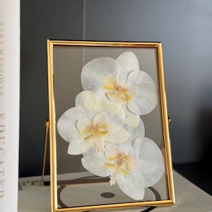 Pressed floral art, white orchids, wedding flowers, Chelsey Walker Creative, 2025