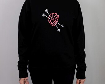 Love Struck Crew Neck Sweatshirt: large embroidered heart struck by two arrows