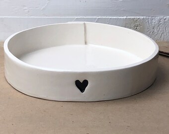 Greens Dish.  5 1/2" Flat Bowl With Low Sides For Greens For Small Friends. Approximately 5 1/2” Diameter.  With A Black Heart.