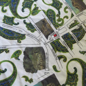 May include: A white fabric map with a paisley pattern. The map shows street names in German, including Hohenzollernstr, Regentenstr, Bismarckstr, Kaiserstr, Goebenstr, and Steinmetzstr. The map also includes a red square labelled "Sittard Design C.D.".