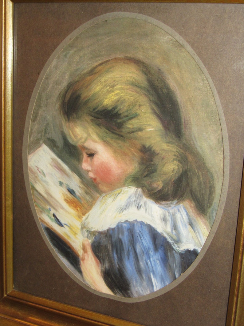 May include: A framed oil painting of a young girl with blonde hair wearing a blue dress and white collar, reading a book.