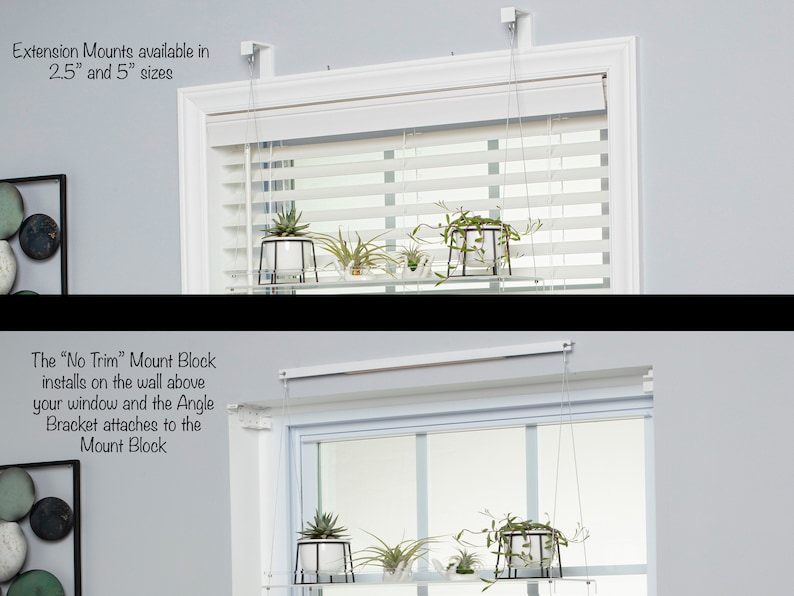 May include: A white window with white blinds and a shelf hanging above it. The shelf is supported by two white brackets attached to the wall. The shelf is holding two small plants. The text "Extension Mounts available in 2.5" and 5" sizes" is visible above the window. The text "The "No Trim" Mount Block installs on the wall above your window and the Angle Bracket attaches to the Mount Block" is visible below the window.