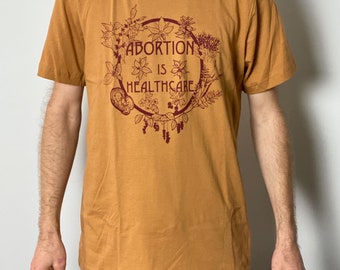 Abortion is Healthcare Herbal Unisex Tee All Profits Donated