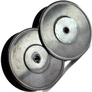 May include: Two overlapping, circular metal pulleys with a silver finish. The pulleys have a central hub with a hole and a slightly concave outer rim. The image is a close-up shot against a white background.