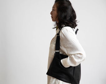 Mochila de piel vegana negra: bolso de viaje convertible