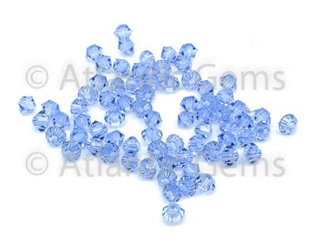 Perle toupie Swarovski 5328 saphir clair 6 mm - 36 pièces