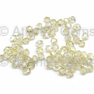 Crystal Lemon Coated AMC 3mm Swarovski 5328 Bicone  - 72pcs