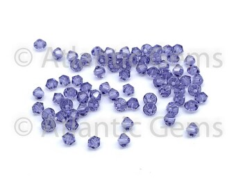 Tanzaniet 4 mm Swarovski 5328 bicone (72 stuks)