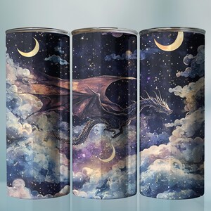 May include: Three cylindrical tumblers with a fantasy design. Each tumbler features a dragon soaring through a starry night sky with clouds and crescent moons. The design is in shades of blue, purple, and brown.