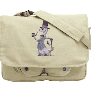 May include: A beige canvas messenger bag with a front pocket and a flap closure. The bag features an embroidered image of a cartoon weasel wearing a top hat, bow tie, and holding a pipe.