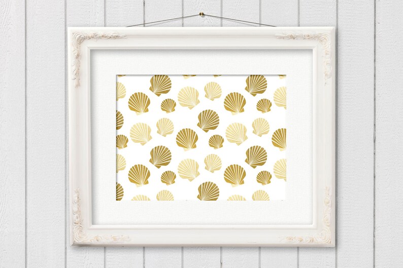 May include: A white picture frame with a gold seashell pattern on a white background. The seashells are in a repeating pattern.