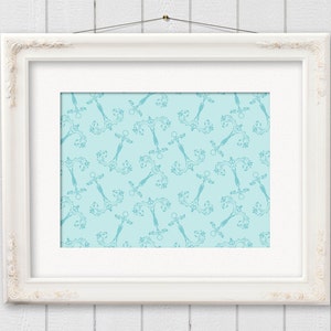 May include: A framed print featuring a repeating pattern of ornate, teal-colored decorative elements on a light blue background. The print is set within a white, ornate frame, hanging against a white wooden wall.
