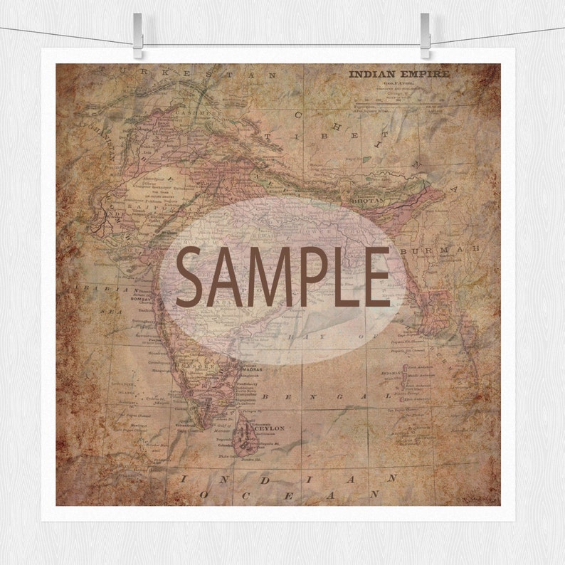 May include: An antique map of the Indian Empire, printed on aged paper with a brown and pink color scheme. The map shows the geographical features of India, including rivers, mountains, and cities. The text "SAMPLE" is superimposed on the map in a brown circle.