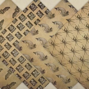May include: Four sheets of brown patterned paper with Halloween themes. One sheet has a repeating pattern of bats, another has a repeating pattern of skeletons, another has a repeating pattern of witches on brooms, and the last sheet has a repeating pattern of spiders.