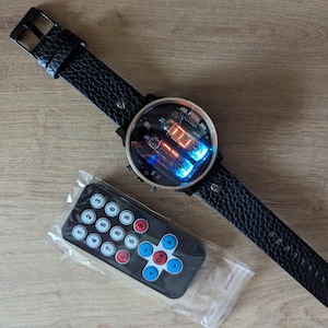 nixie tube watch wrist IV-9 numitron clock ticker style compact neon-lit wristwatch glowing gas discharge tubes