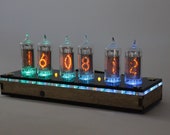 Nixie tube clock z570 or LC-531 analog of IN-14 but has fine 5, not upside down 2, remote control, temperature sensor, cool illumination