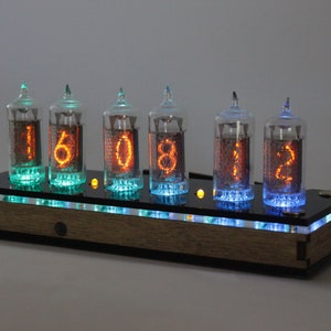 Nixie tube clock z570 or LC-531 analog of IN-14 but has fine 5, not upside down 2, remote control, temperature sensor, cool illumination