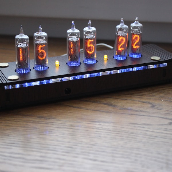 Nixie tube clock include IN-16 tubes and handmade enclosure housing old school combined with handmade retro custom date codes