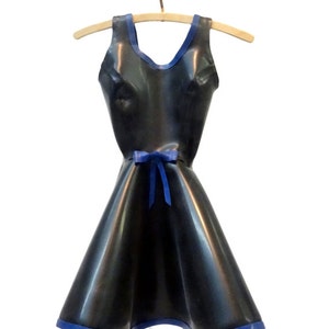 May include: A black latex dress with a blue trim and a blue ribbon at the waist. The dress is hanging on a wooden hanger.