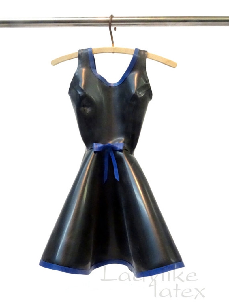 May include: A black latex dress with a blue trim and a blue ribbon at the waist. The dress is hanging on a wooden hanger.