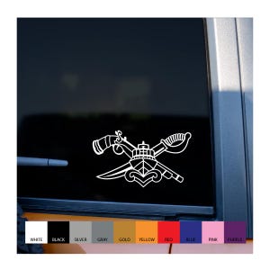 May include: White vinyl decal featuring a crossed sword, knife, and ship design, with a horn and a decorative element. The decal is displayed on a vehicle window, with color options at the bottom.