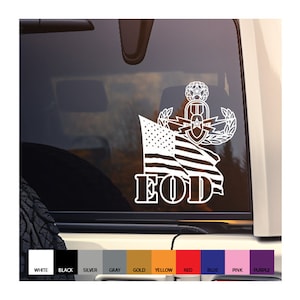 May include: White vinyl decal of an American flag with the words "EOD" below it. The flag is draped over a military EOD badge with a star and lightning bolts.