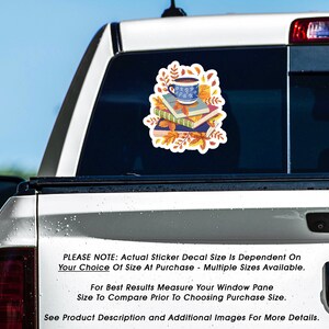May include: A sticker decal featuring a stack of books with a cup of coffee on top, surrounded by autumn leaves. The text "PLEASE NOTE: Actual Sticker Decal Size Is Dependent On Your Choice Of Size At Purchase - Multiple Sizes Available." is below the image.  "For Best Results Measure Your Window Pane Size To Compare Prior To Choosing Purchase Size." is below the text.  "See Product Description and Additional Images For More Details." is below the second line of text.