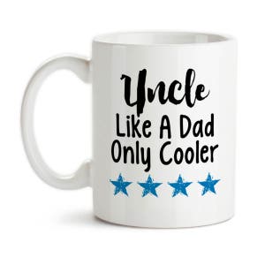 May include: White ceramic coffee mug with a black inscription that reads "Uncle Like A Dad Only Cooler" with four blue stars below the text.